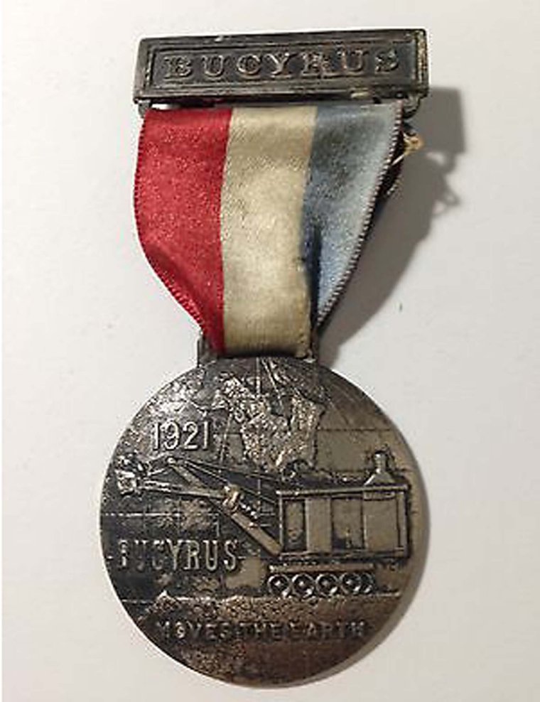 An-Old-And-Dated-Watch-Fob-In-The-Woods